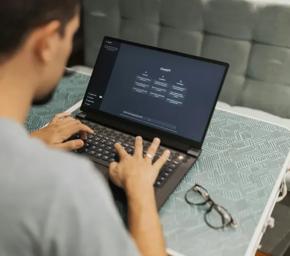 Person using ChatGPT on a laptop